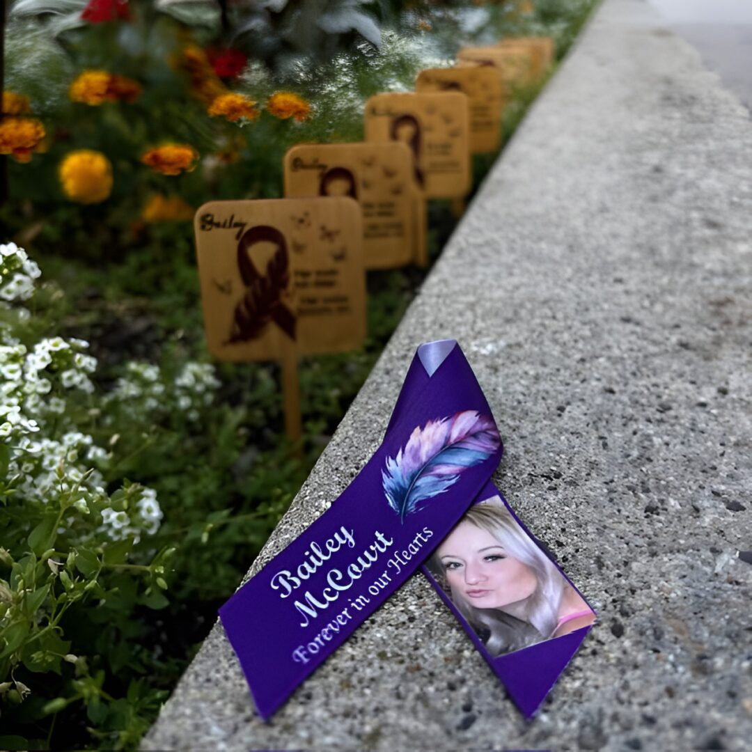 Purple ribbon and photo memorial for World AIDS Day.